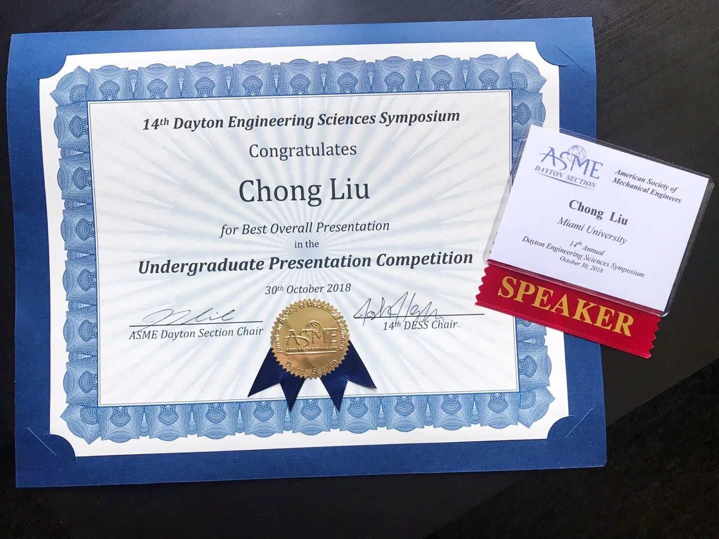 14th DESS certificate for Best Overall Presentation in the Undergraduate Presentation Competition, awarded to Chong Liu, beside an ASME Dayton Section speaker badge